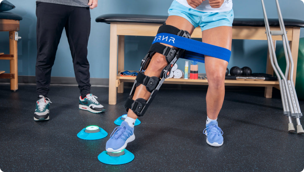 An injured person in rehabilitation tapping out a Pod light with an injured leg