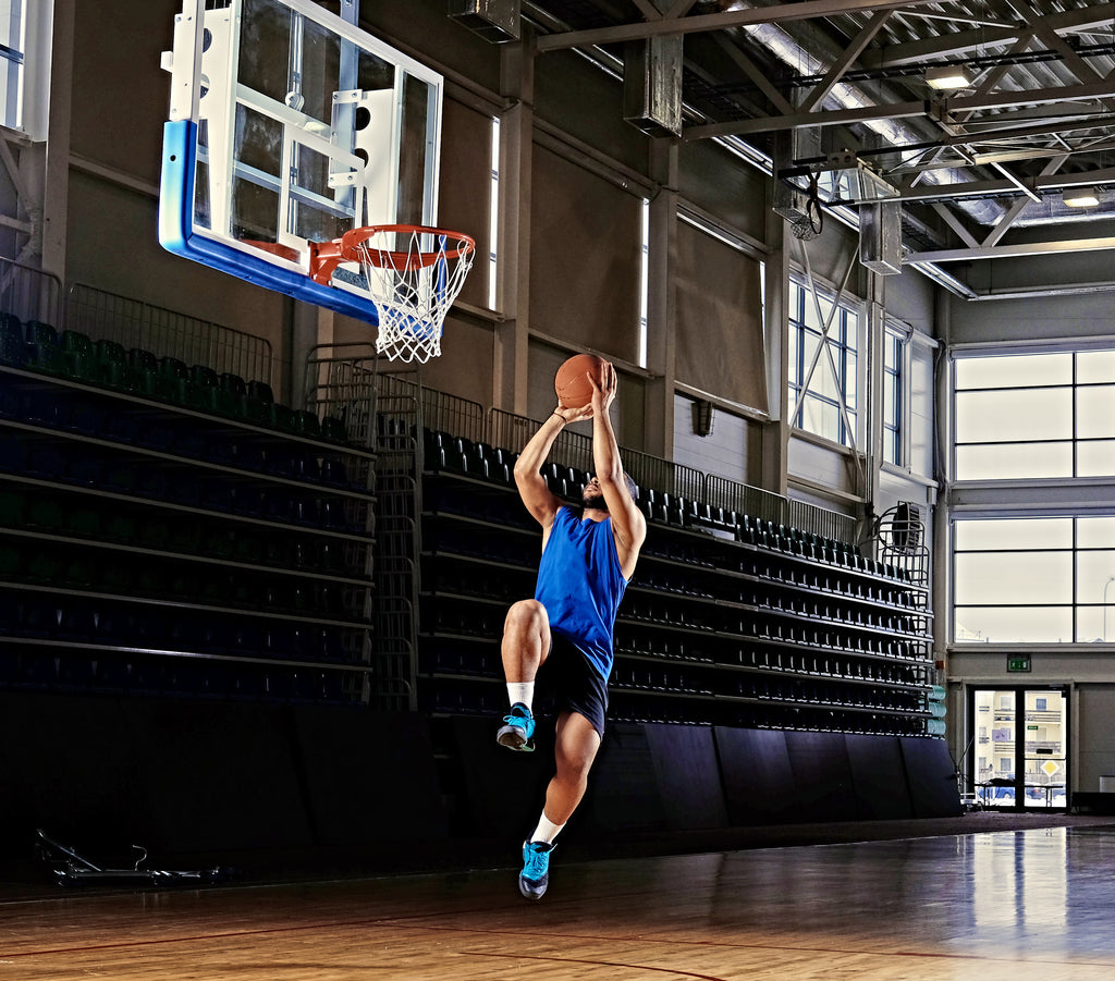 A basketballer shooting a hoop