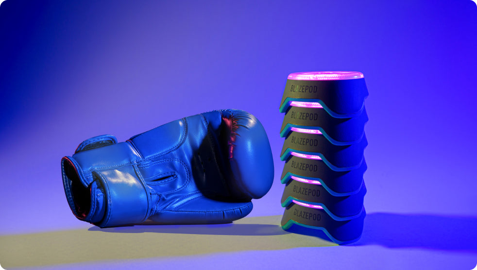 A boxer's glove and BlazePod Pods