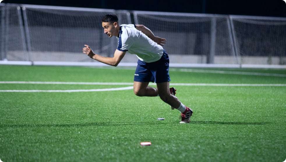 A soccer player sprinting