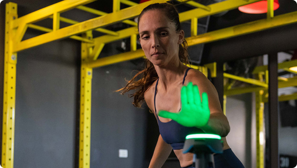 An athlete at the gym tapping out a BlazePod Pod