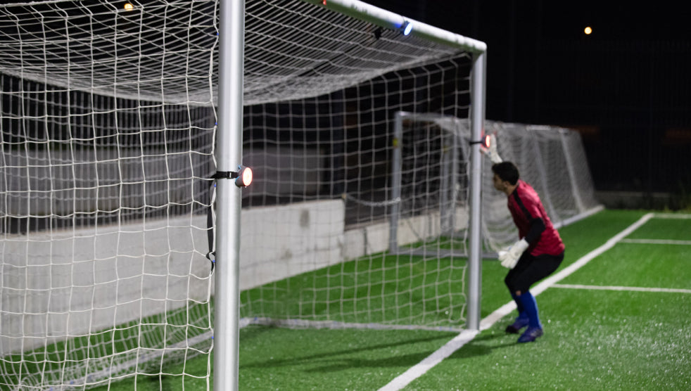 A goalkeeper defending the goal