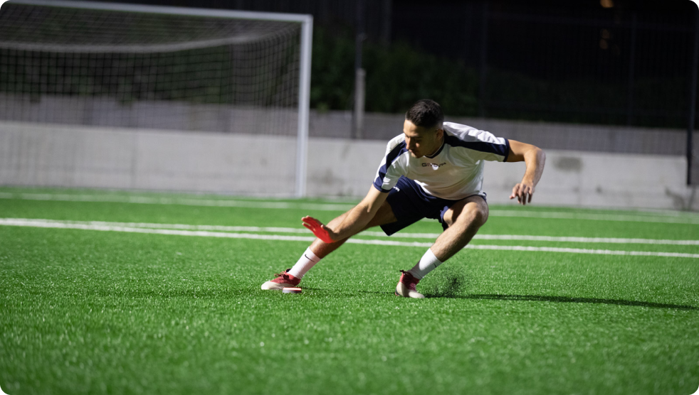 A soccer player running fast to tap out a Pod