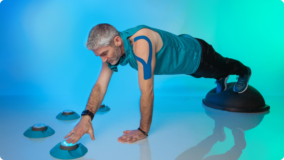 A man in a plank position tapping out a Pod